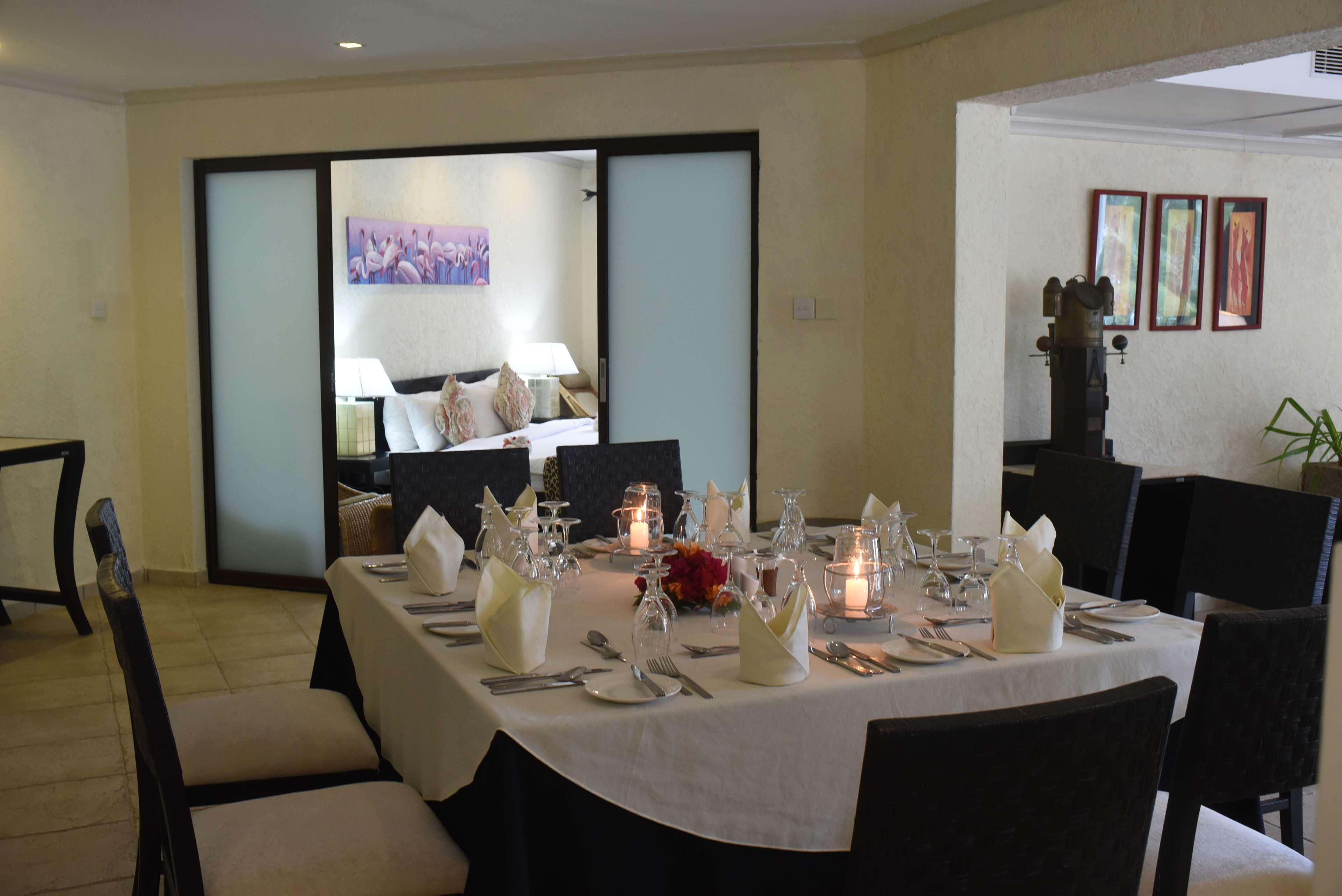 Diani Reef Beach Resort & Spa - Your Beachfront Bliss Awaits Діані-Біч Екстер'єр фото A table set for dinner
