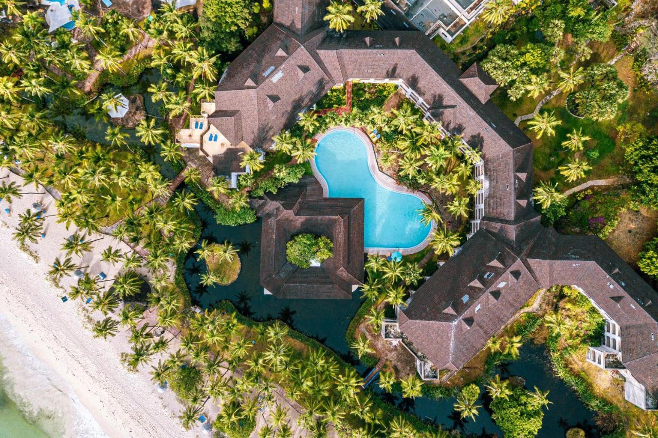 Diani Reef Beach Resort & Spa - Your Beachfront Bliss Awaits Діані-Біч Екстер'єр фото Aerial view of the resort